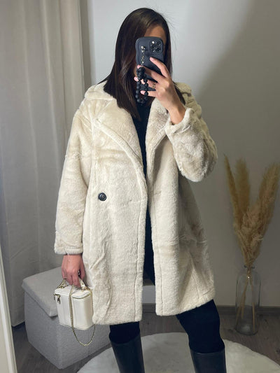 Veste longue beige en fourrure